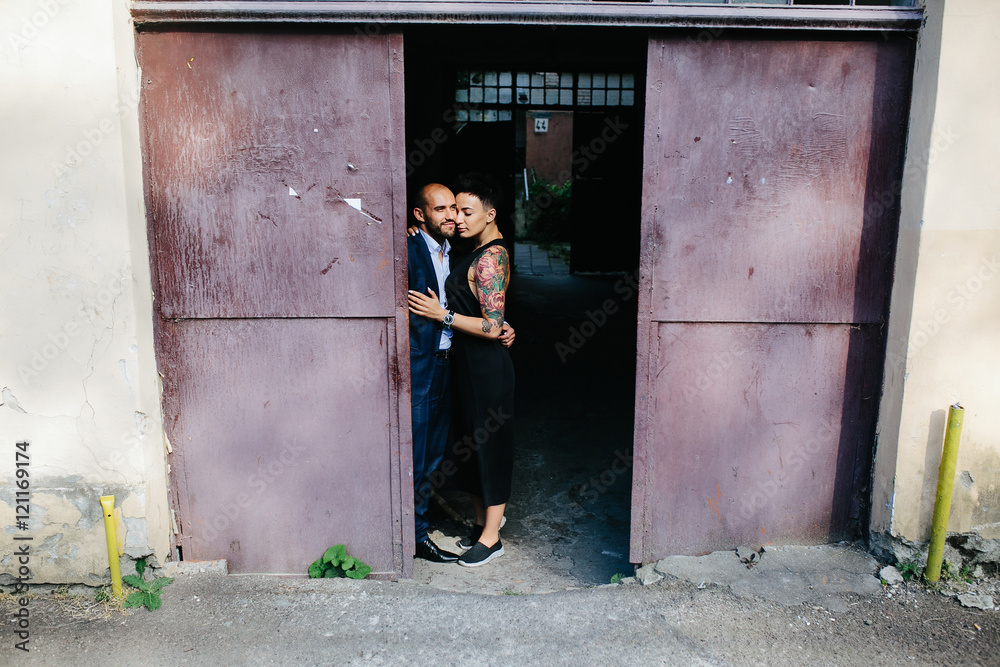 man and woman hugging in the doorway