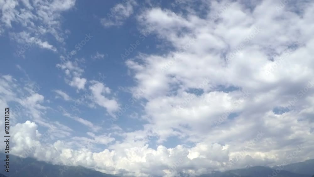 Time lapse clouds travel over mountains. Time lapse clouds travel over mountains.