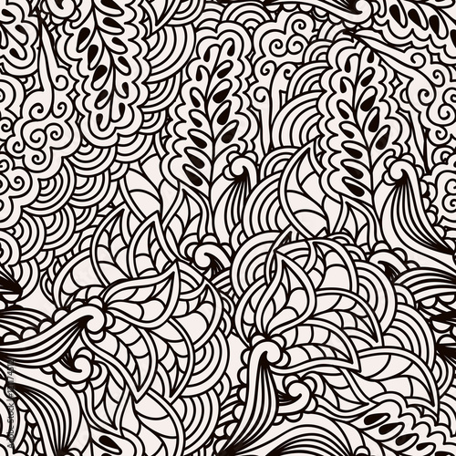 Black and white seamless pattern with hand drawn ornate floral ornament in zentangle style.