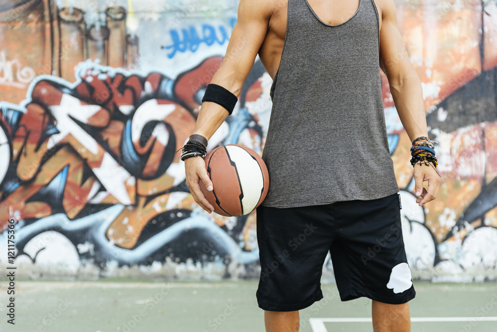 Fototapeta premium Man holding basket ball.