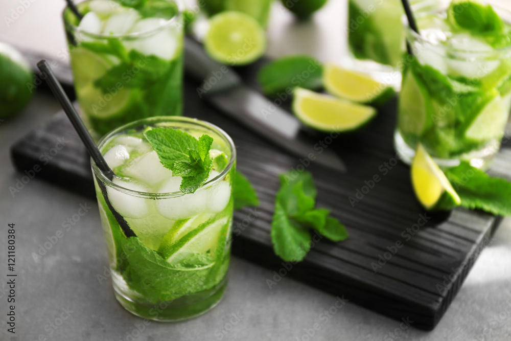 Cold fresh cocktail with lime on table Cold fresh cocktail with lime on table