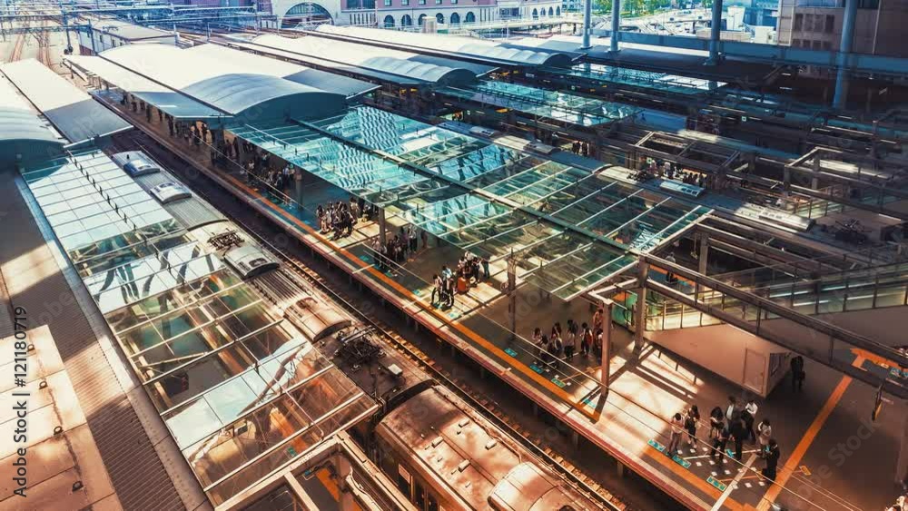 Time-lapse of trains and commuters inside Osaka Station in Osaka, Japan. 