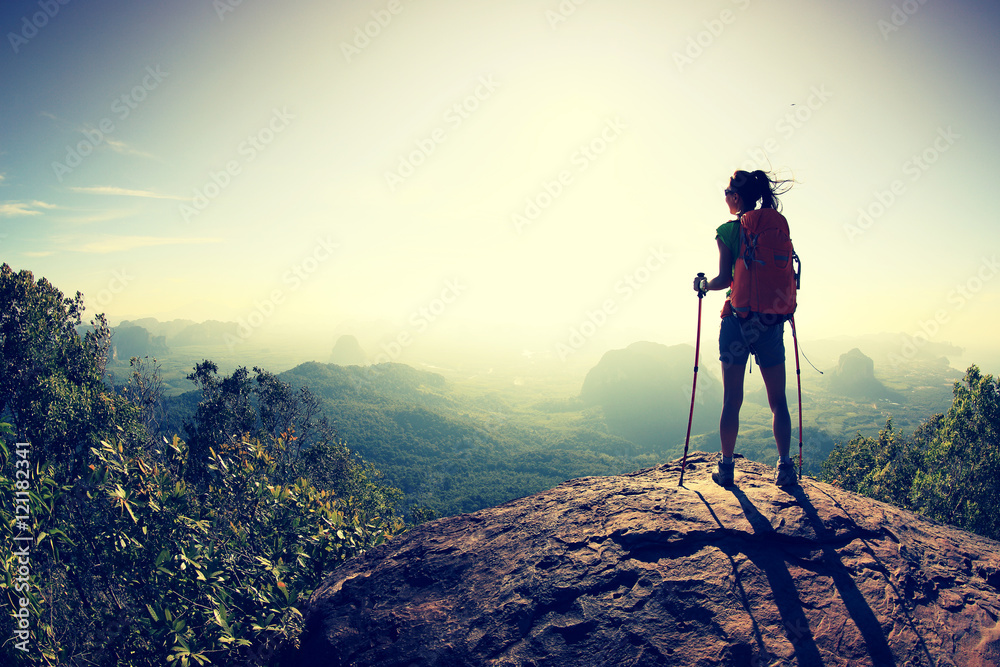 successful woman hiker at sunrise mountain peak - obrazy, fototapety, plakaty 