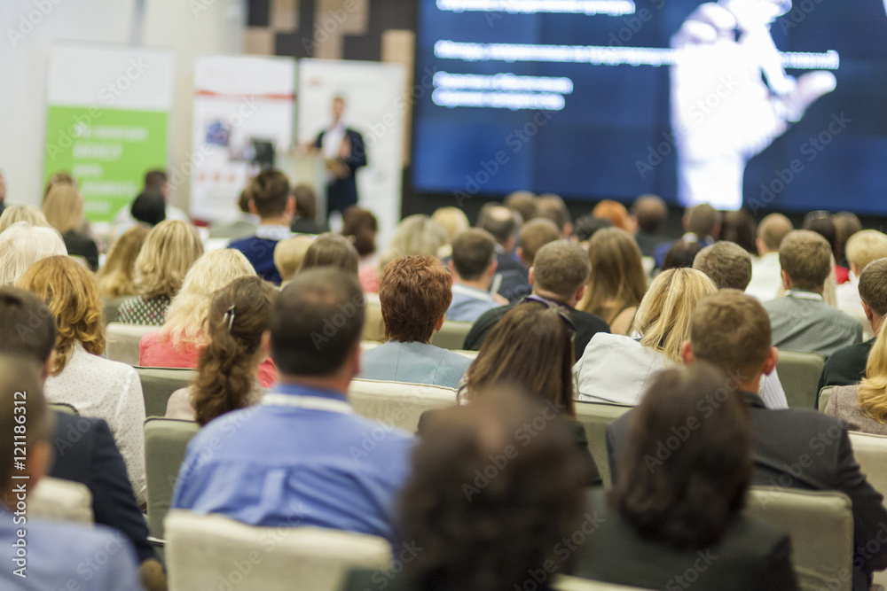 Obraz premium Male Host Speaking in Front of the Audience During Business Conference