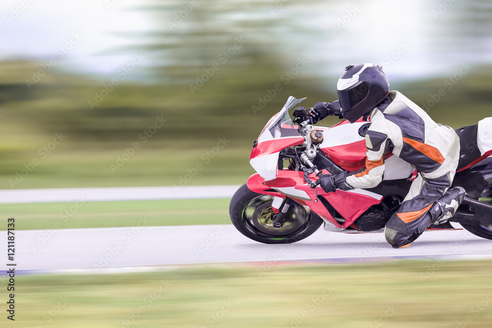 Fototapeta premium Motorcycle leaning into a fast corner on highway