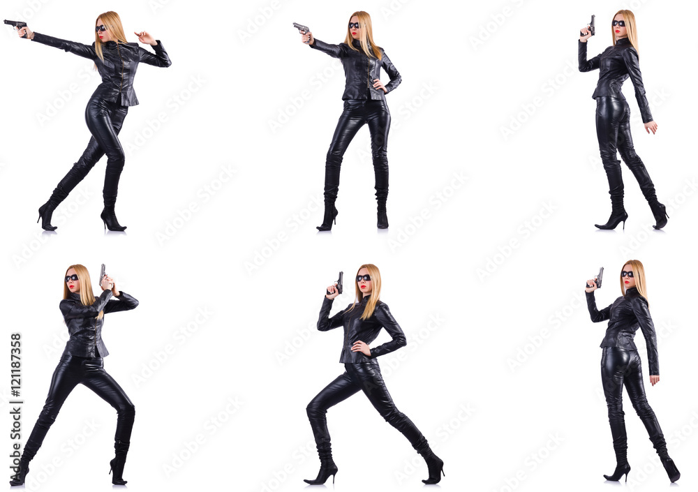 Woman in leather costume with gun isolated on white Woman in leather costume with gun isolated on white