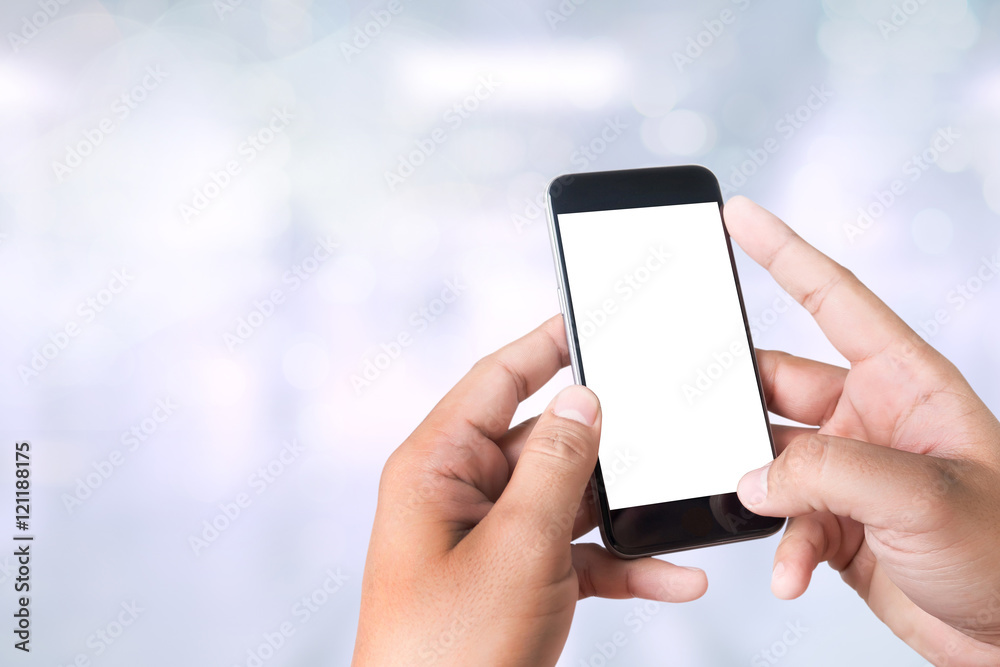 person holding a smartphone on blurred cityscape background person holding a smartphone on blurred cityscape background