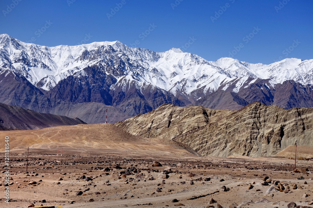 Snow mountain range at road side viewpoint on the way to Khardung La from Leh LADAKH, INDIA