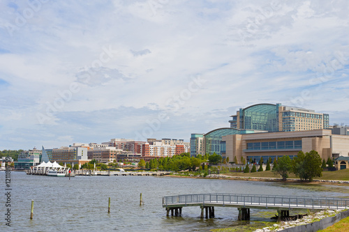 National Harbor waterfront panorama in Oxon Hill, Maryland, USA. Water transport pier services visitors coming from Washington DC.