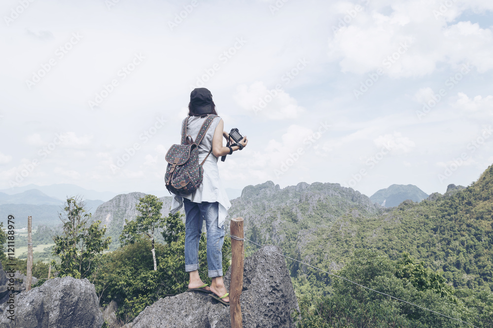 Woman backpacker is look nature background.Freedom of life.