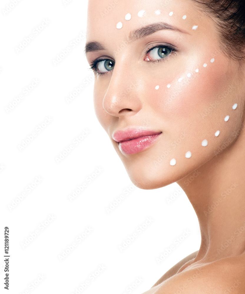 Fototapeta premium Beautiful Young Woman applying facial moisturizing cream.Skincar