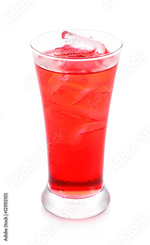 red sparkling water with ice in a glass isolated on white