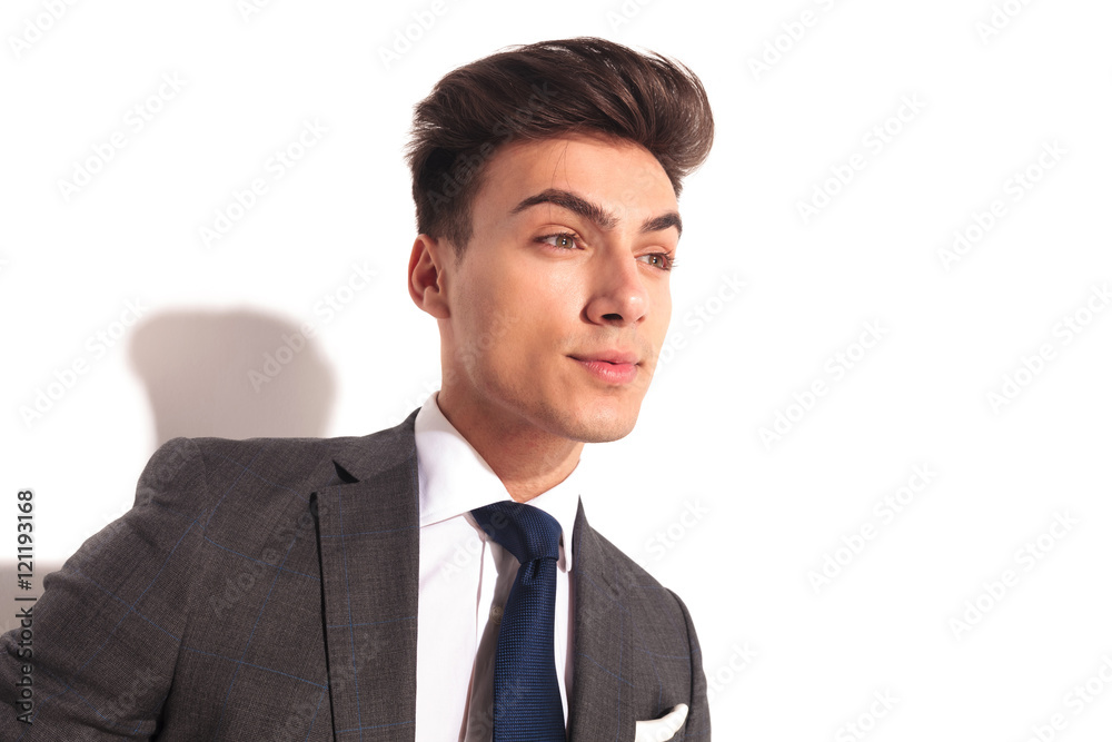 closeup picture of a young business man looking to side closeup picture of a young business man looking to side