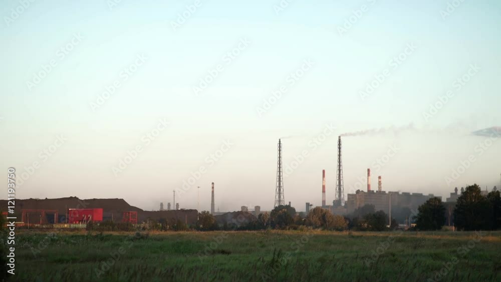 Smoke goes from the chimney. Industrial pipe. From pipe goes smoke. Air pollution. Factory in the contryside The plant is located in the city. Smoke goes from the chimney. Industrial pipe. From pipe goes smoke. Air pollution. Factory in the contryside The plant is located in the city.