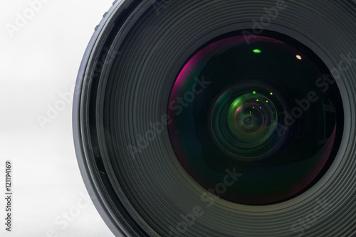 Front view of black camera lens isolated on white background