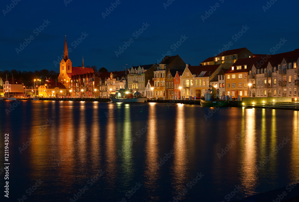 Night view on the Sonderborg. Harbour. the lights of the evening city reflected in the water.   Southern Denmark.