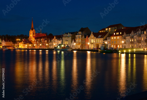 Night view on the Sonderborg. Harbour. the lights of the evening city reflected in the water.   Southern Denmark. photo
