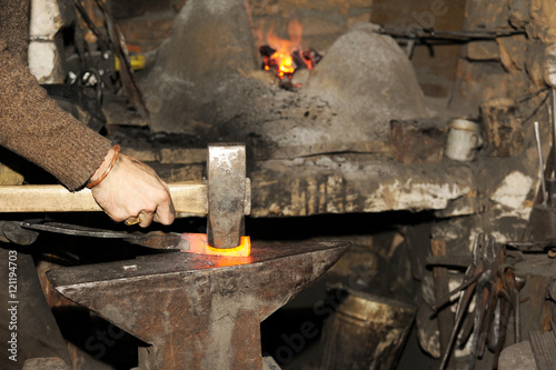 Blacksmith working in the forge 
