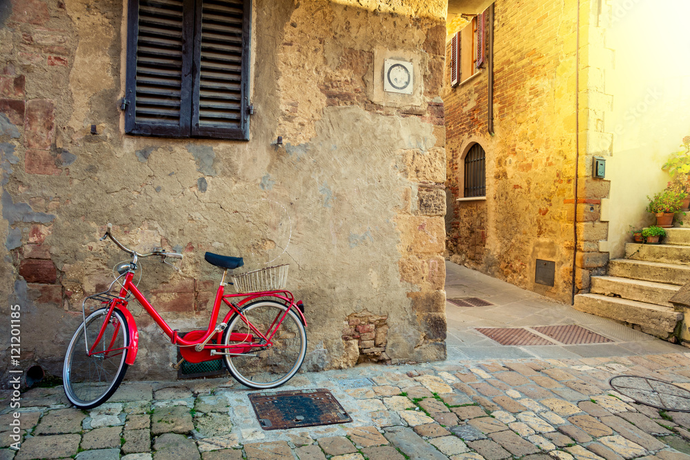 Old Mediterranean town street with red retro bike
