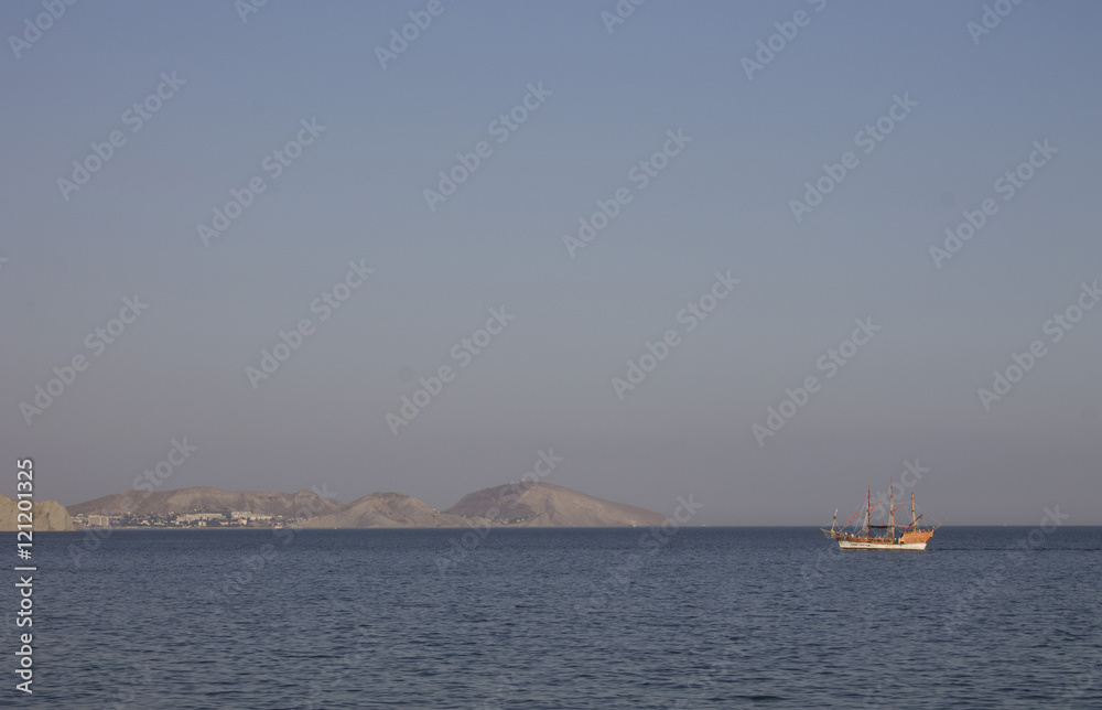 Sailboat floats on the Black Sea. Crimea
