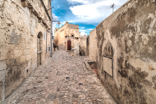 typical old street view of Matera under blue sky