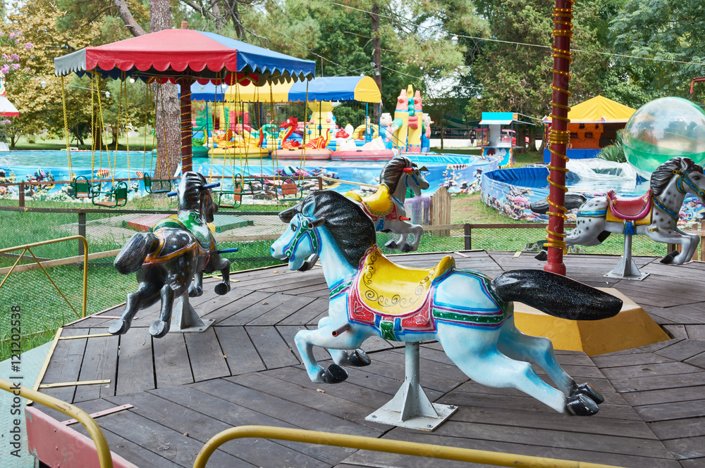 Carousel with horses in fair