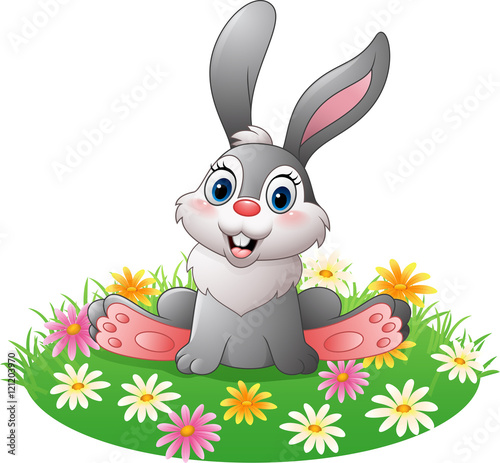 Cartoon rabbit sitting on the grass