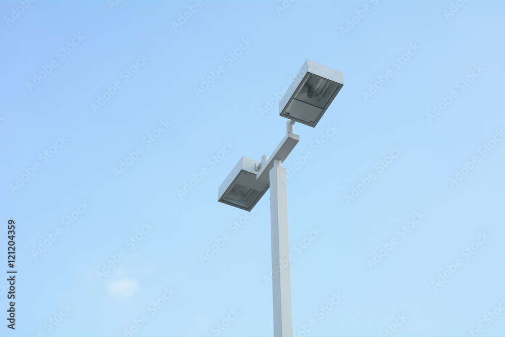 Double street light lamp post or lantern on a blue sky background Double street light lamp post or lantern on a blue sky background