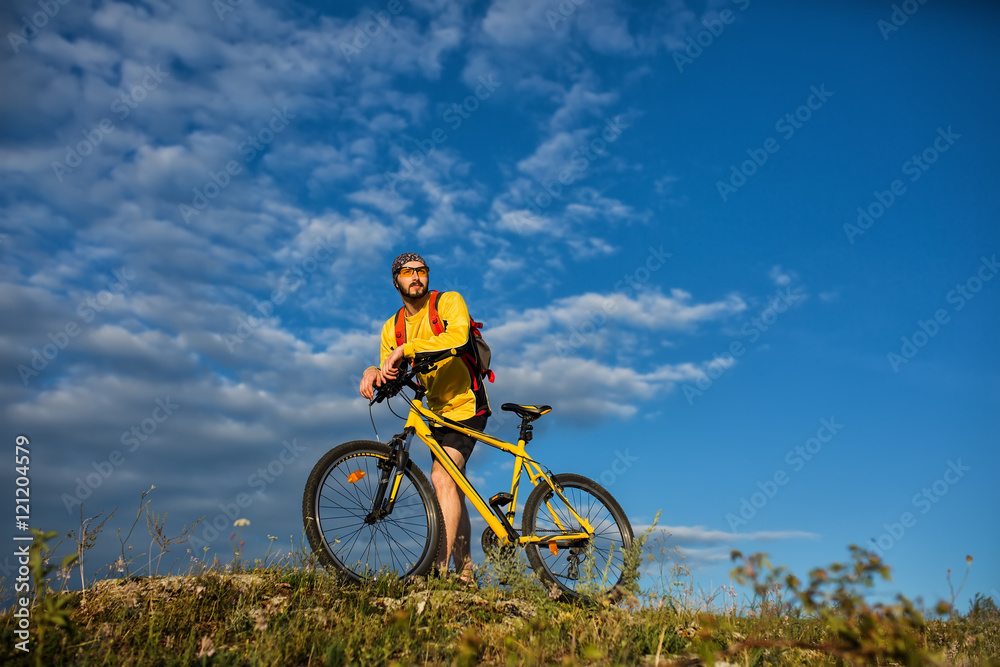 Cyclist Riding the Bike on the Trail