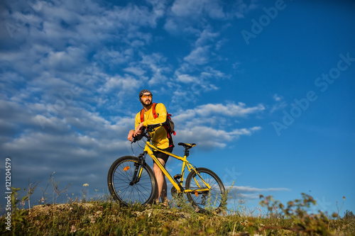 Cyclist Riding the Bike on the Trail © Aleksey