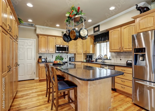 Kitchen room interior in Luxury home with maple cabinets.