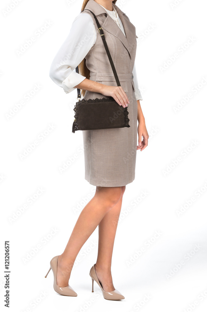 Woman holding a handbag isolated on white background Woman holding a handbag isolated on white background