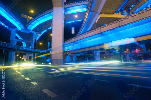 City view at night with traffic and trail light in Shanghai China.