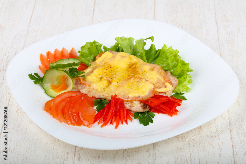 Pork steak with tomato and cheese
