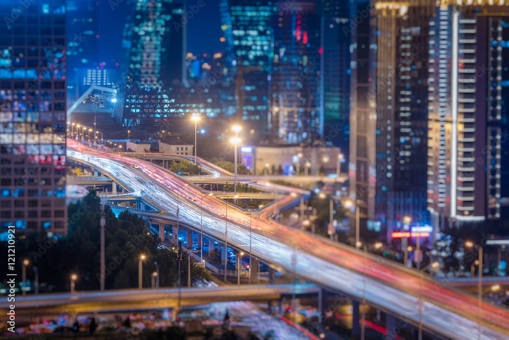 blurred traffic light trails on road at night in China. blurred traffic light trails on road at night in China.