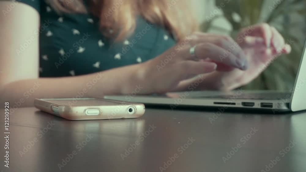 Hands typing on computer keyboard and use phone Hands typing on computer keyboard and use phone