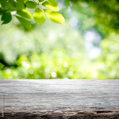 Empty wooden table with garden bokeh background with a country outdoor theme,Template mock up for display of product