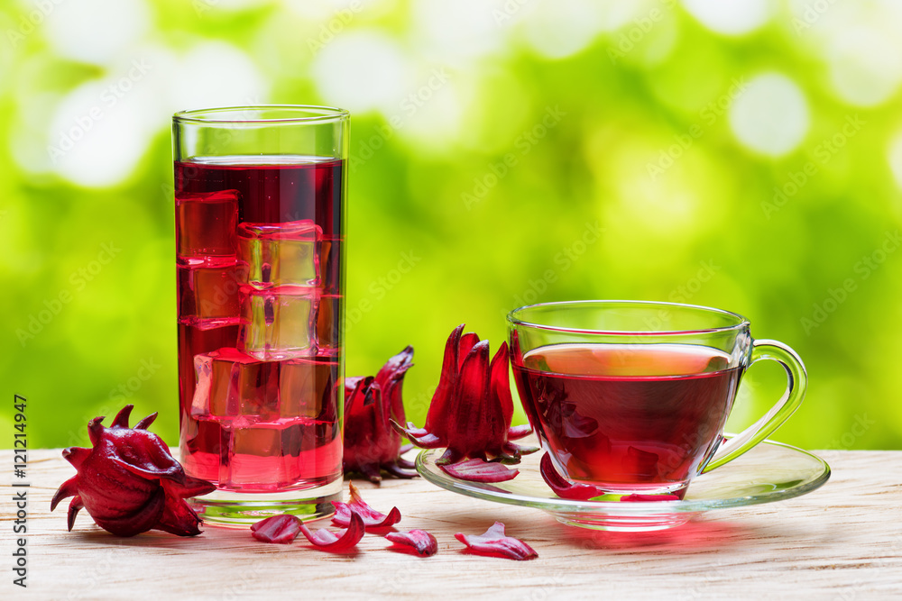 Cup of hot hibiscus tea and the same cold drink in glass Cup of hot hibiscus tea and the same cold drink in glass