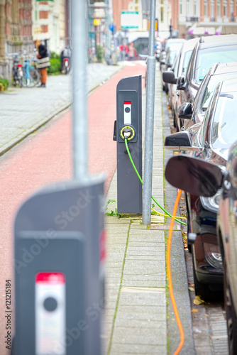 Electric cars charging on the road