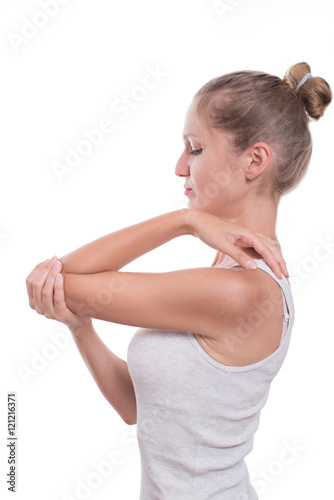 Elbow pain. Young woman holding her elbow 