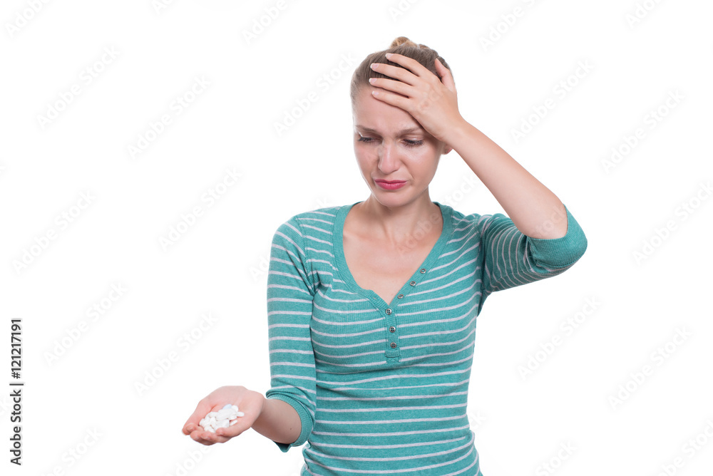 Unhappy woman holding painkillers, isolated on white background Unhappy woman holding painkillers, isolated on white background