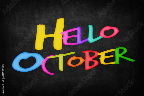 Hello October word on blackboard background