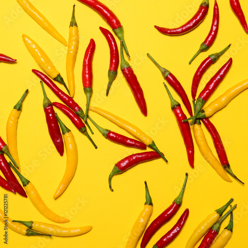 Red hot chili peppers on yellow background - Flat lay