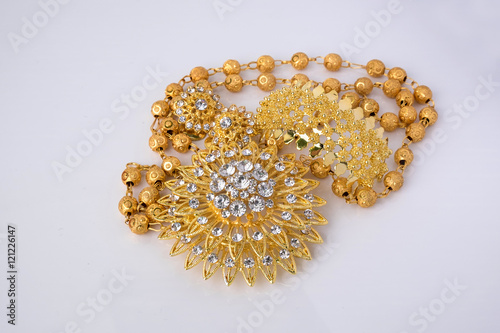 shiny gold  jewelery on white background