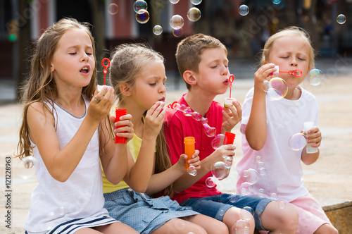 Kids playing with soap bubbles