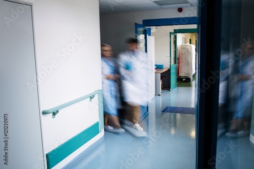 Blur view of doctors walking in corridor