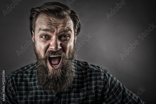 Closeup portrait of a furious  man yelling photo