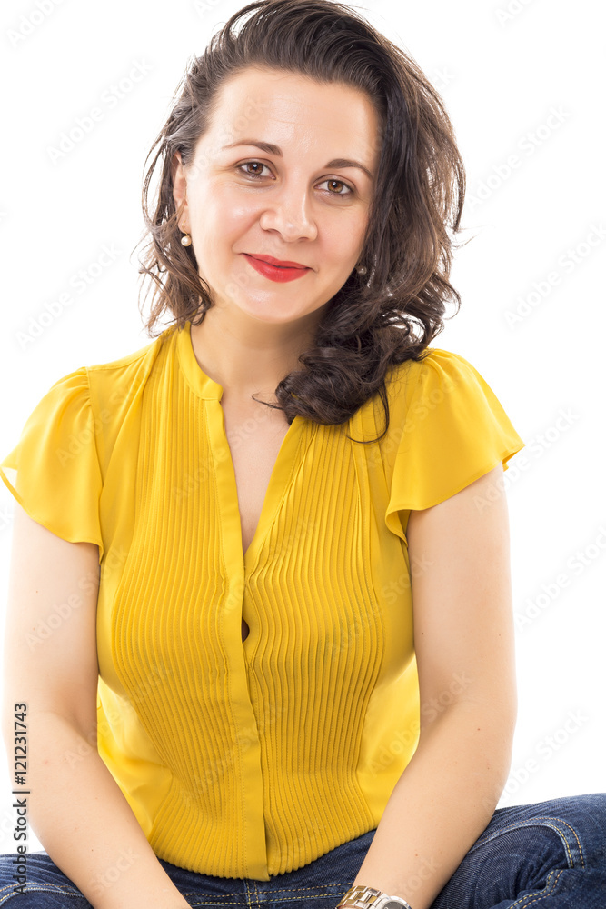 Beautiful young woman sitting on floor against white Beautiful young woman sitting on floor against white