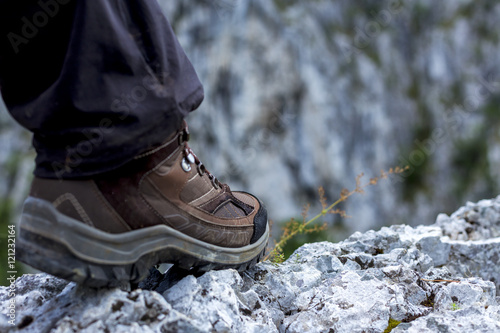 Closeup of trekking boot in the mountain