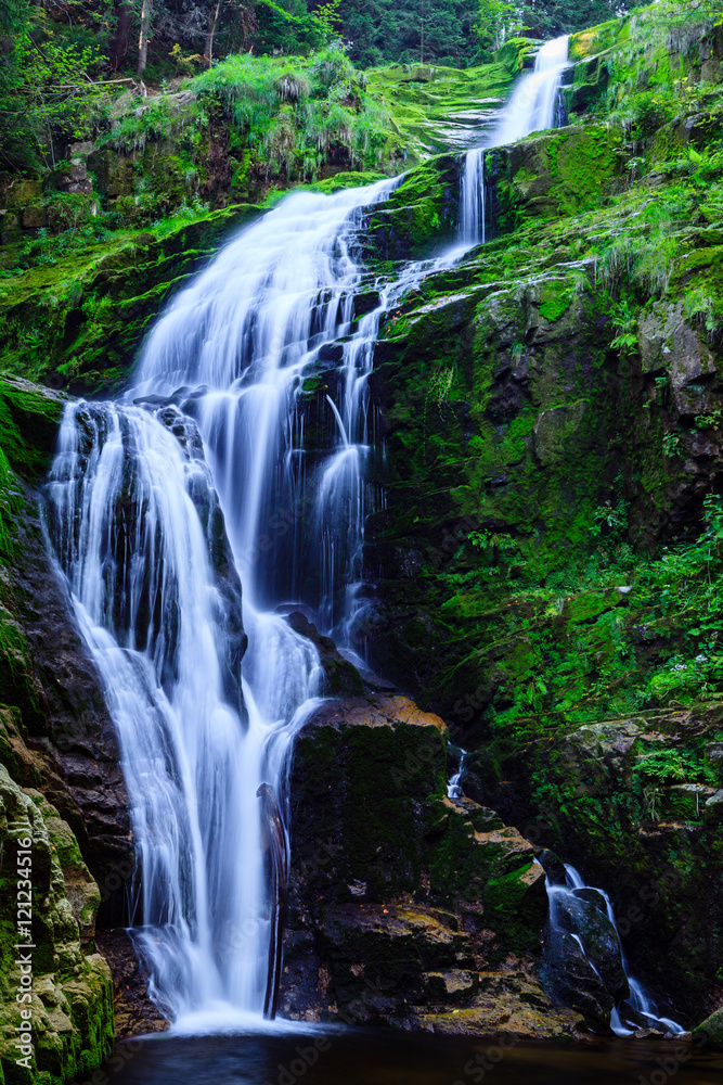 Obraz premium Kamienczyk Waterfall in Karkonosze National Park in Poland Sudety Mountains near Szklarska Poreba town.